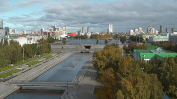Summer big mobile city from a height. Stock footage. Bright summer view of the river and bridges where cars drive. video