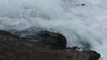 Close up of fast mountainous waterfall stream and wet big stones. Creative. Cold river on a summer day. video
