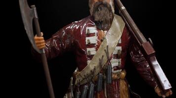 Historical small model of a warrior with an axe. Stock footage. Close up of suit of a man with a gun. video