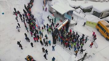 Top view of winter running marathon. Clip. Crowd of running people in winter race. Start of winter running marathon in forest part video