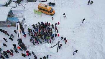 Winter competitions. Clip. A group of athletes gathered in winter weather for jogging in the forest. Use only for editorial. video