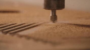 Close-up of machine for patterns on wood. Creative. Industrial machine with cutting needle on surface of wooden board. Automated machine carves patterns on wood video