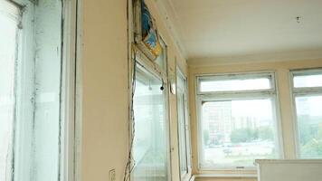 View inside of an empty old apartment with many big windows. Stock footage. Flat needs renovation. video