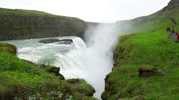 GULLFOSS WATERFALL, ICELAND - JUNE 20, 2016 Beautiful landscape of Gullfoss waterfall in Iceland with tourists walking in summer season. video
