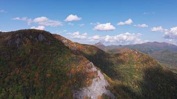 Aerial View of a Mountain Range With Clouds in the Sky video