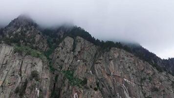Majestic clouds drifting gracefully over a stunning mountain peak video
