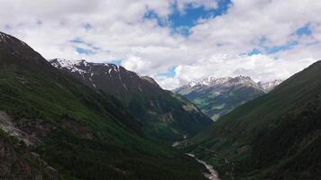 Majestic clouds drifting over a serene mountain valley video