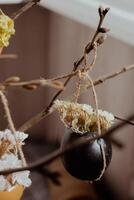 Tutorial How to make Easter table decoration with egg shells step by step instruction. Easter home decoration on wooden branch. Seasonal sustainable recycled decor photo