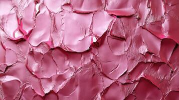 Crumpled pink material reflecting silver light creating abstract pattern photo
