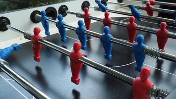 Football table or soccer table game with plastic player figurine. Mini Soccer game which famous in past and be collectable item for foosball lover. Play by two hand control each row of player figurine photo
