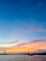Aerial view to sunset on the river at summer evening with cloudy sky. photo