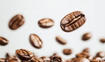 Coffee beans falling and scattering on white background. photo