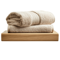 Soft beige towels neatly stacked on a wooden surface, perfect for a spa or bathroom setting. isolated on transparent background. png