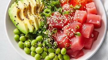 A bowl of sushi with avocado, tuna, and green peas photo