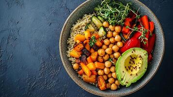 A bowl of vegetables and beans with a side of quinoa photo