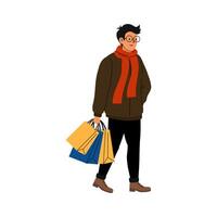 Man carrying shopping bags while walking in a casual winter outfit during a sunny day vector