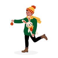 A child in a winter outfit joyfully carrying a plush bunny and a festive ornament vector