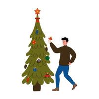 A man decorates a Christmas tree with colorful ornaments during the holiday season at home vector