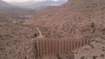 Aerial landscape view authentic mudflow control dam in Areni village, Armenia. Mud flow control dam structure in valley video
