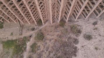 Aerial descending view authentic mudflow control dam in Areni village, Armenia. Mud flow control dam structure in valley video