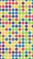 Cute polka dot pattern background in bright vibrant colors. Shiny colorful buttons effect. Full HD looping vertical animation. video