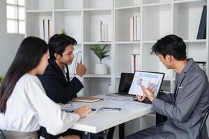 Business Team Collaborating in Modern Office, Exchanging Ideas and Discussing Work Strategies photo