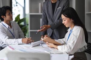 Business People in a Modern Office Meeting, Discussing Strategies and Taking Notes for Future Projects photo