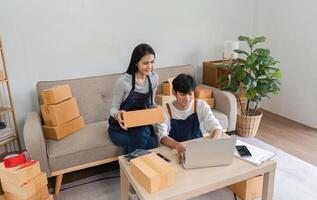 Couple Checking Merchandise Boxes for Online Delivery in a Modern Home Setting photo