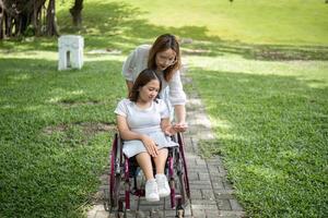 Young Disabled Woman and Best Friend Enjoying Outdoor Activities Together in a Park Setting photo
