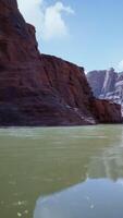 A serene mountain lake surrounded by rocky cliffs video
