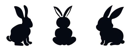 Set of black silhouettes of rabbits isolated on a white backgrou vector