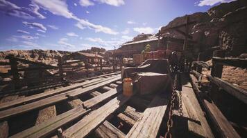 Abandoned wooden structure in a desert landscape during midday light video