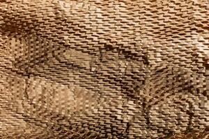 Textured close up of protective eco friendly cardboard packaging material, emphasizing sustainability and recycling concepts photo