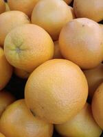 Orange is a citrus fruit with a sweet and sour taste, a fragrant smell, high in vitamin C, many varieties, inexpensive, full of medicinal properties. photo