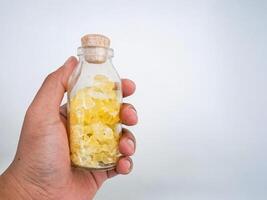 rock sugar on bottle isolate on white background. photo