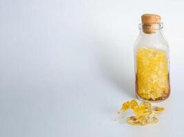 rock sugar on bottle isolate on white background. photo