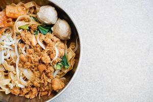 chicken noodle with meat balls and vegetables photo
