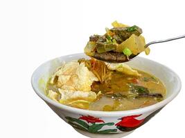 soto kuning is an authentic soto from bogor, indonesia. photo