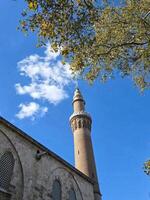 mosque tower with bright sky in Turki photo