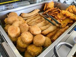 Typical Indonesian fried foods such as bakwan, risol, perkedel photo