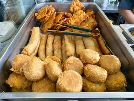 Typical Indonesian fried foods such as bakwan, risol, perkedel photo
