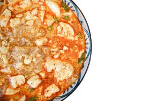 Spicy Kway Teow Soup with Tofu isolated on white background photo