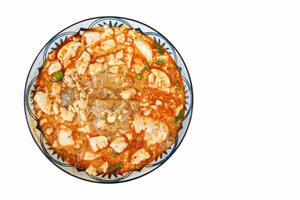 Spicy Kway Teow Soup with Tofu isolated on white background photo