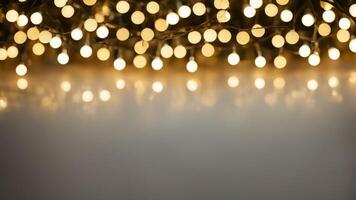 Defocused warm yellow string lights on blurred background with soft glow. Bokeh effect with copy space. Holiday decoration concept photo