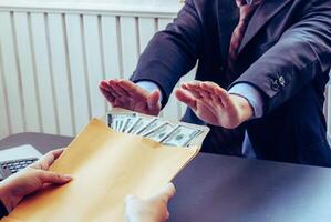 Blur image,corruption on officials in order to obtain items and projects that they want as an offense by giving money for corruption. idea of combating and preventing corruption by government official photo