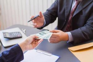 Blur image,corruption on officials in order to obtain items and projects that they want as an offense by giving money for corruption. idea of combating and preventing corruption by government official photo