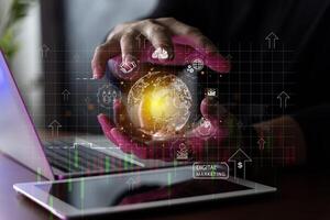 Digital online marketing Businessman using tablet and analyzing sales data graph growth on modern interface icon on strategy photo