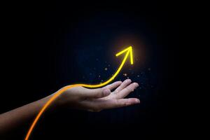 Hand pointing growth arrow success business target background of up icon direction development graph or investment finance profit stock market chart symbol. photo