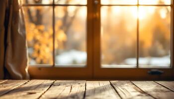 An empty wooden table with a window in the background photo