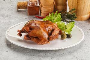 Baked small chicken with spices photo